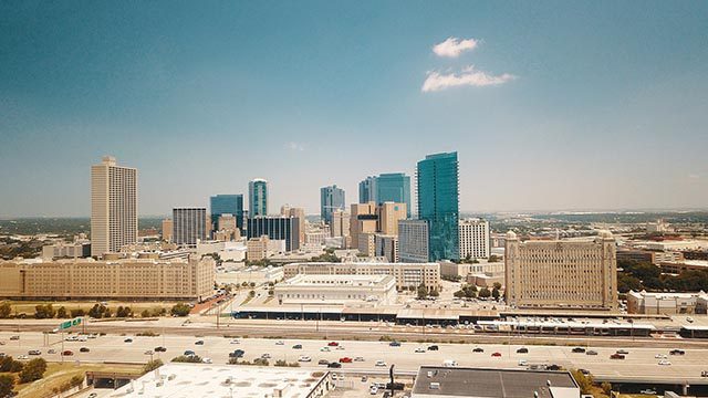 Fort Worth cityscape with clear blue sky.